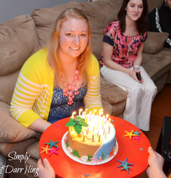 birthday girl with beach cake