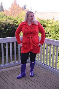 A spring outfit featuring purple hunter rain boots and a red rain jacket