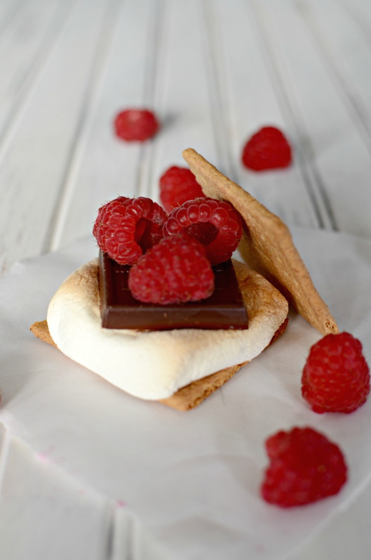 Gourmet s'more with chocolate and raspberries