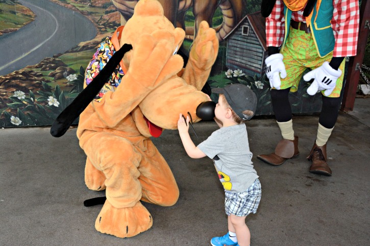 Toddler Kissing Pluto on the Nose at Animal Kingdom