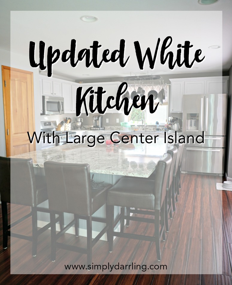 Updated White Kitchen With Large Central Island