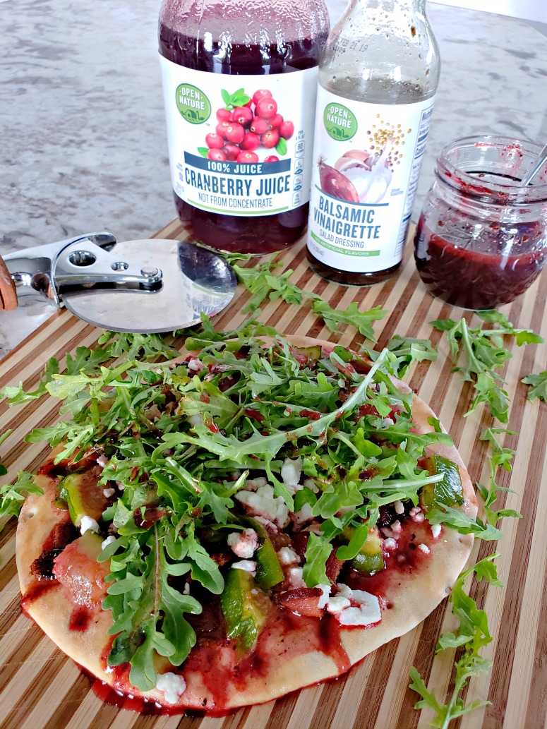 Flatbread featuring bacon, arugula, figs and goat cheese