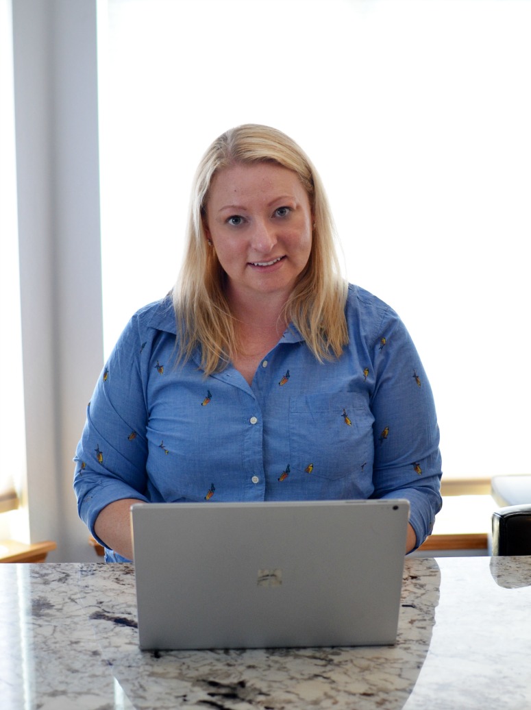 Woman using Microsoft Surface Book