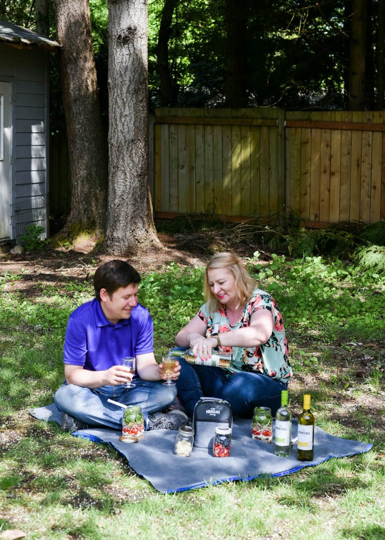 Couple having a backyard picnic