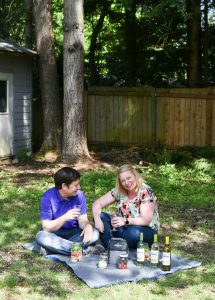 Couple having a backyard picnic