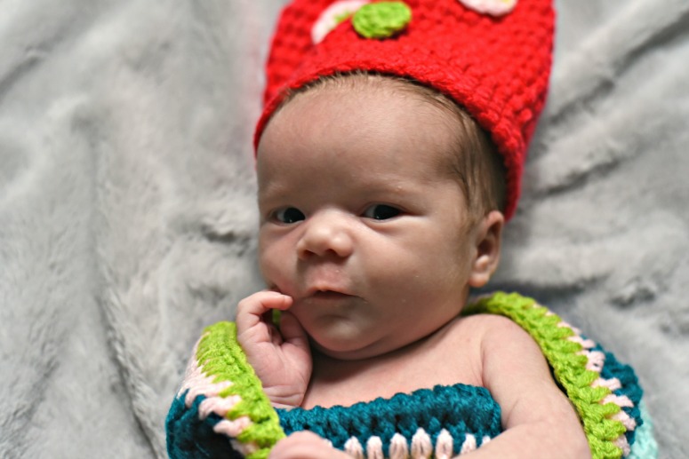 Baby in Knit Caterpillar Outfit