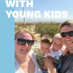 smiling family of four with text overlay of "traveling with young kids"